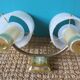 Pair of brass and gold plastic sconces with granite lampshades, France 1950