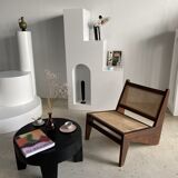 Reclined armchair in canned teak in natural wood