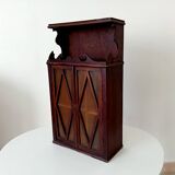 Small antique wall cabinet in Gothic style.