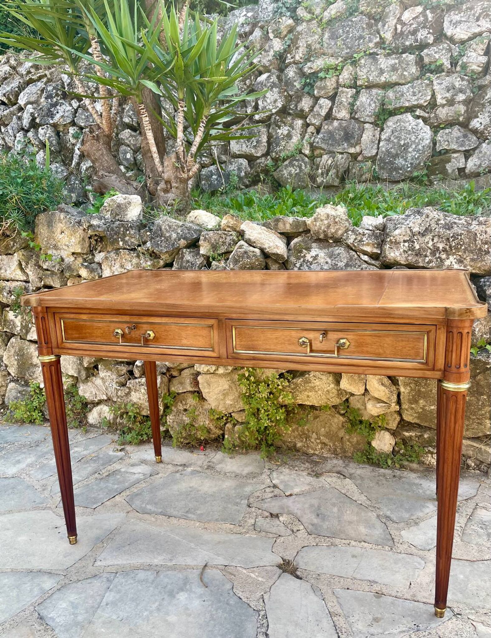 Louis XVI style mahogany flat desk from the late 19th century