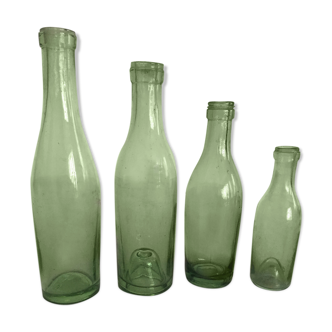 Set of 4 old thick glass bottles