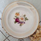 Old hollow plates mismatched in earthenware with gilded edges