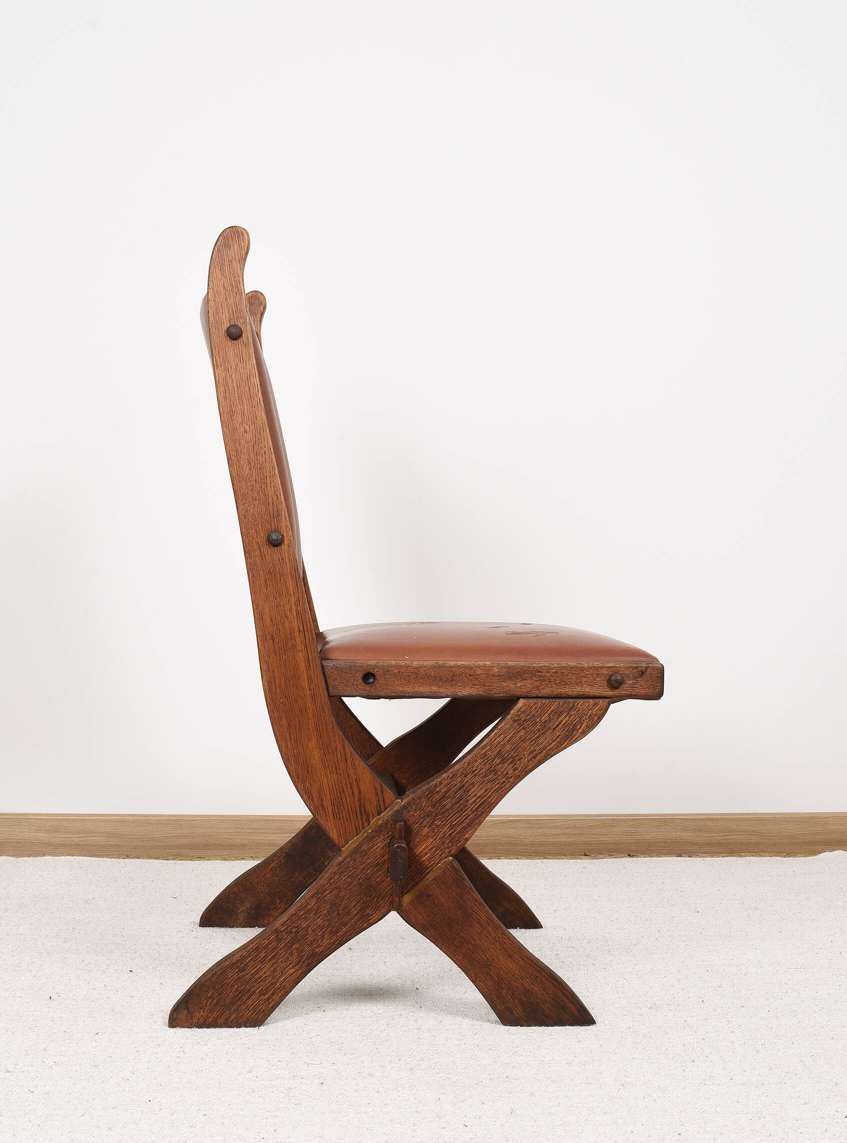 Pair of brutalist style chairs, in wood and leather.