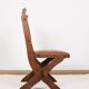 Pair of brutalist style chairs, in wood and leather.