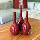 Handcrafted curved bottle vase in Bordeaux.