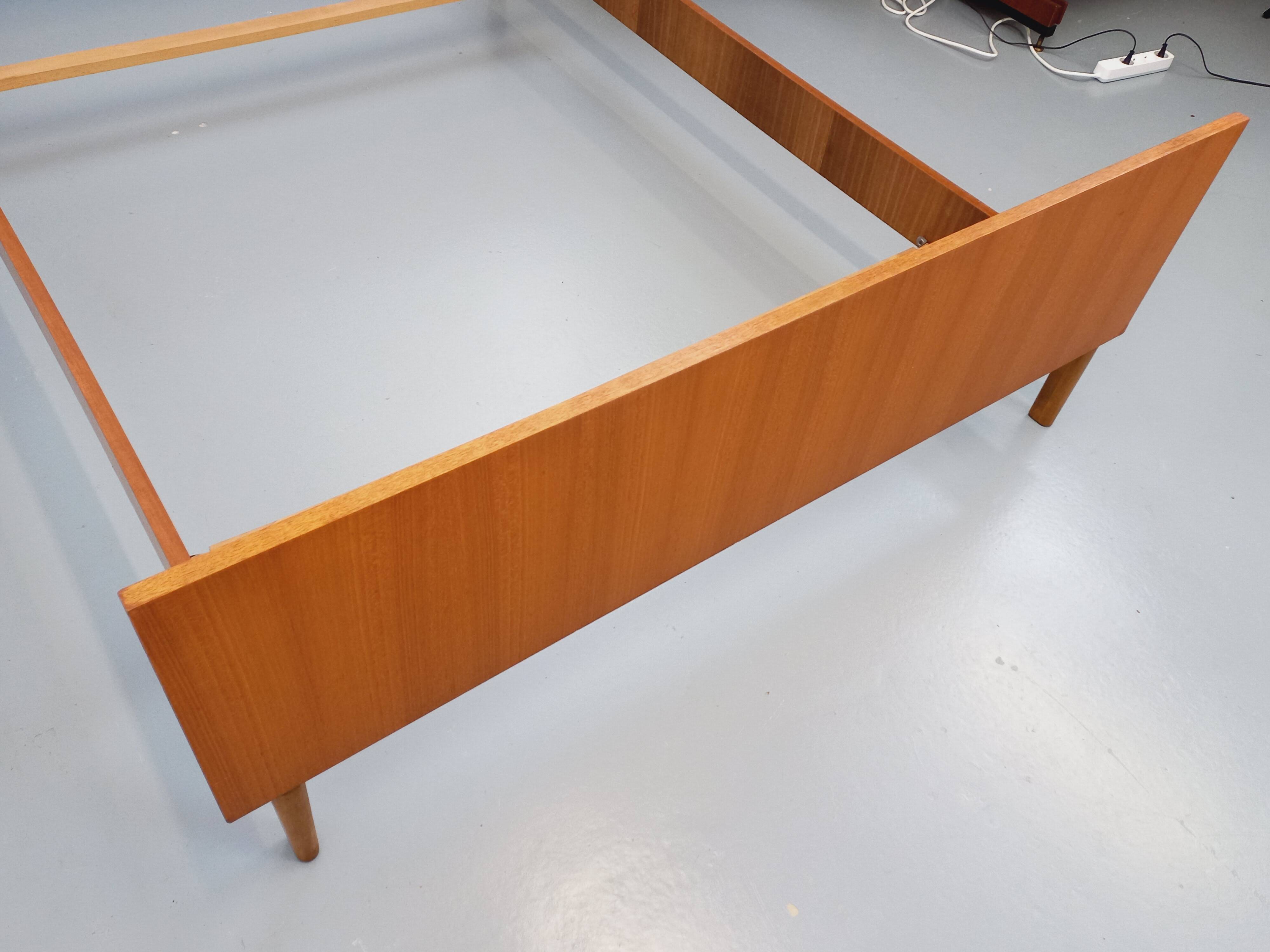 Vintage Scandinavian style double bed in teak from the 60s with integrated bedside lights