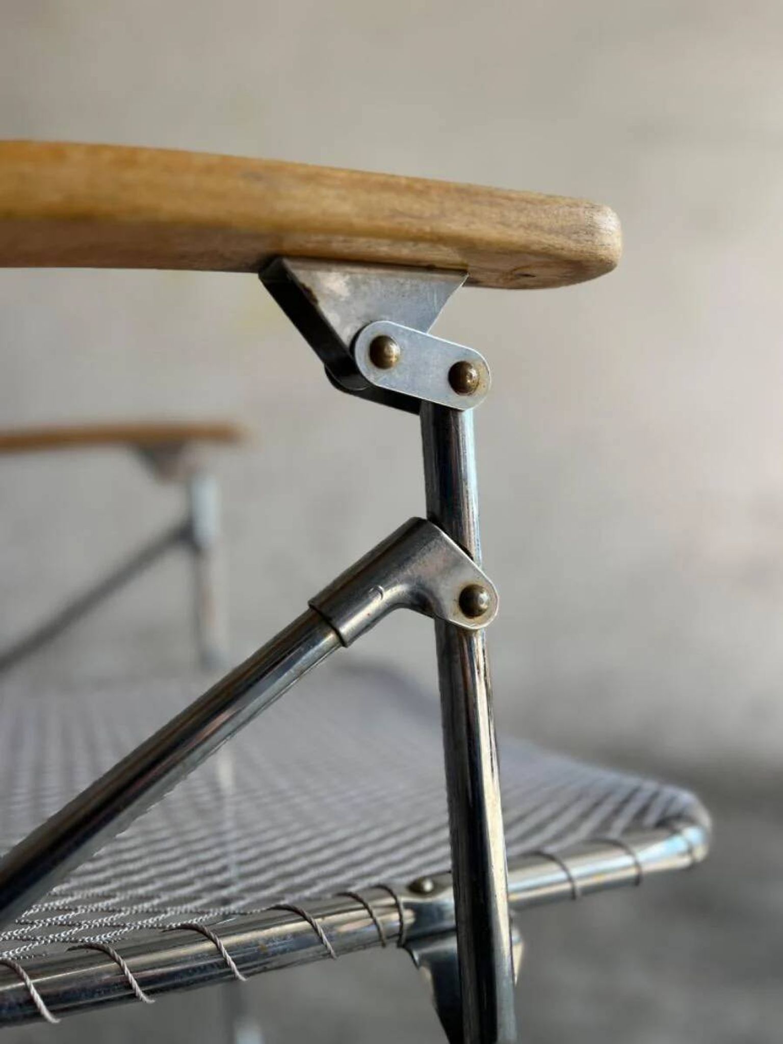 Set of two vintage folding chairs with an aluminium wire frame.