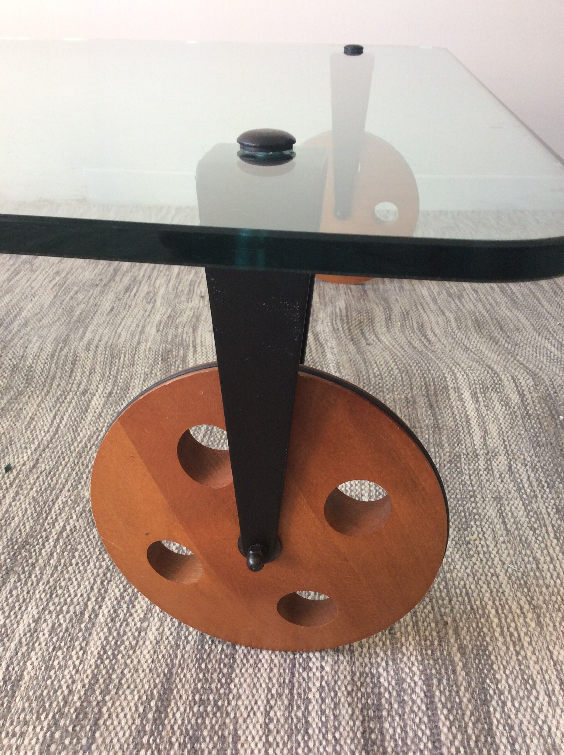 Glass coffee table on teak wheels