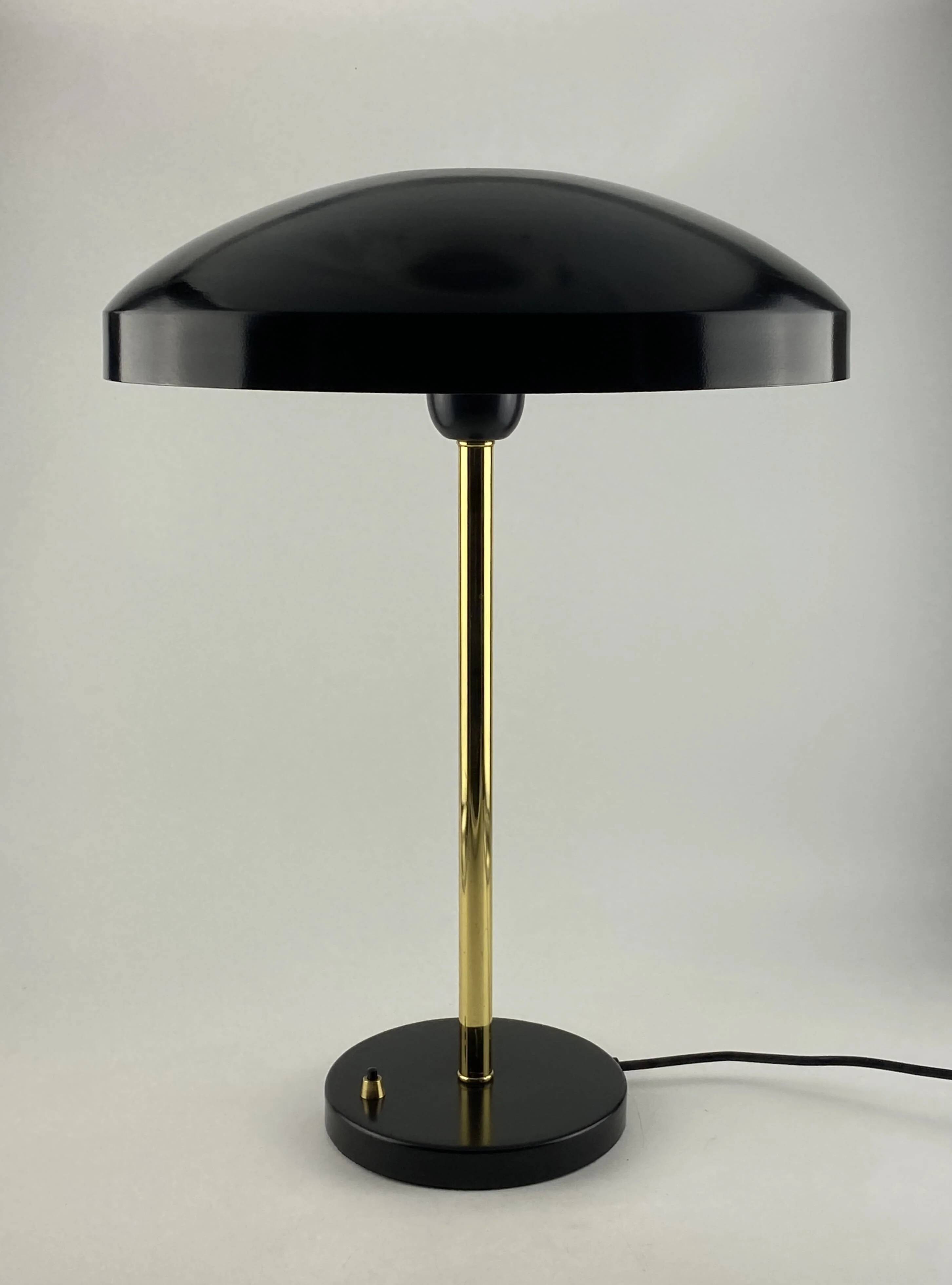 Rare black and gold UFO table lamp by Louis Kalff for Philips.