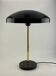 Rare black and gold UFO table lamp by Louis Kalff for Philips.