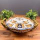 Handled coupe in Gien earthenware with heraldic and fantastic decoration.