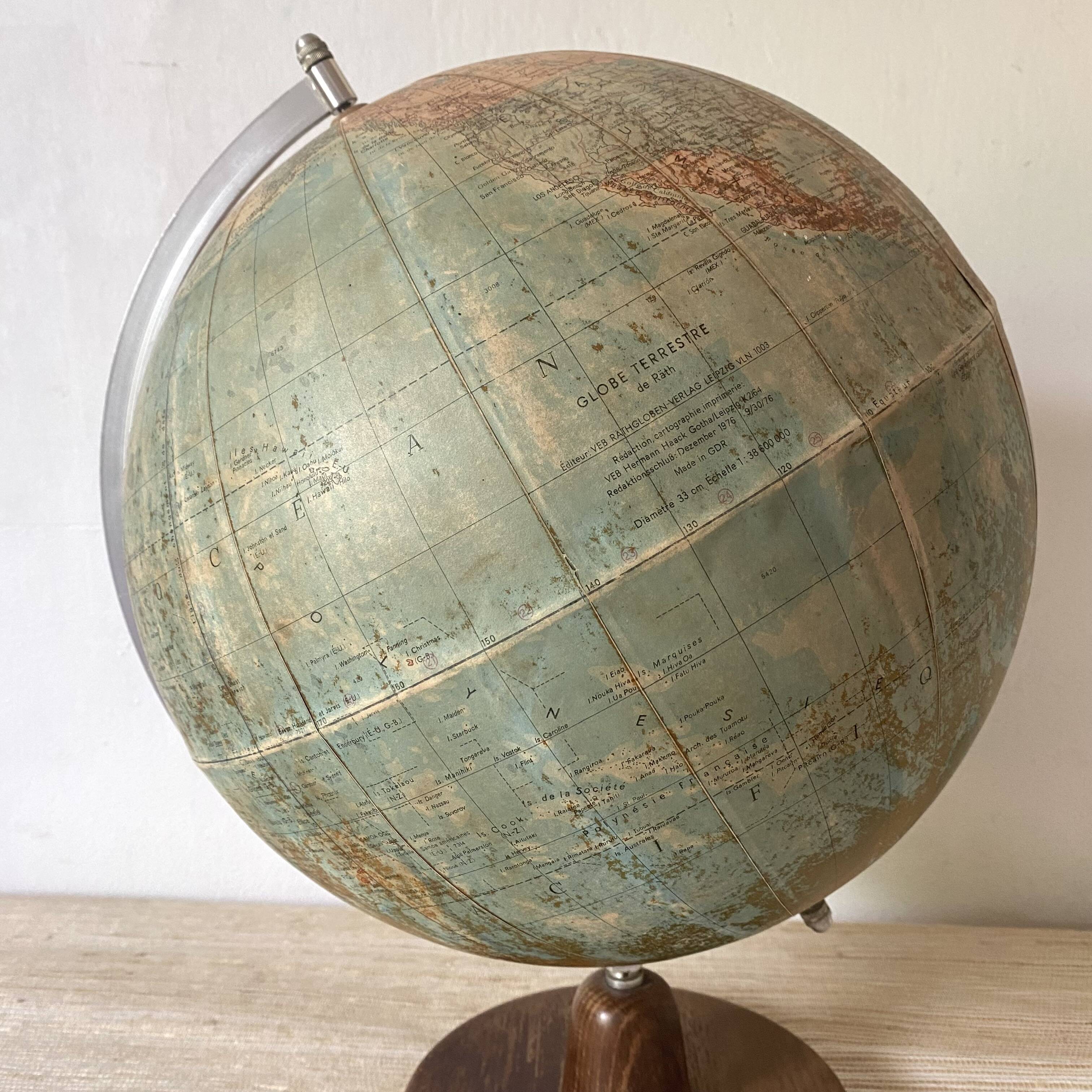Old terrestrial globe with wooden base H46 cm