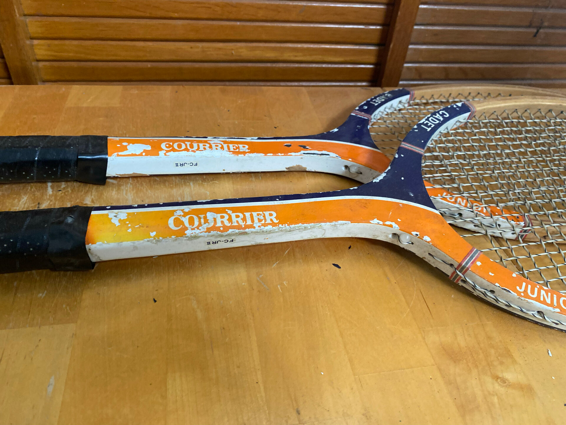 Pair of vintage wooden tennis rackets for cadet junior sport courier