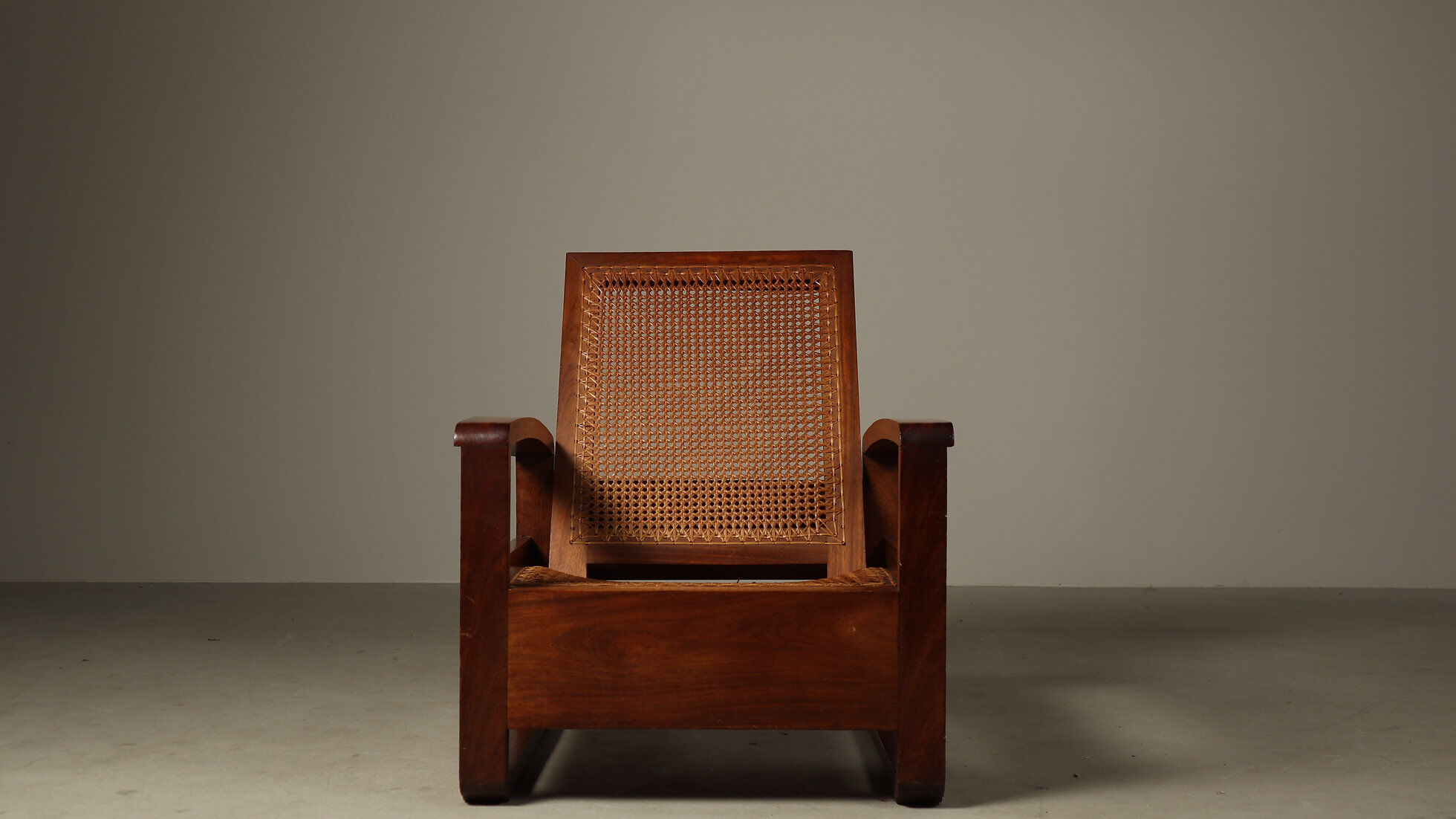 Mid-century architectural teak lounge chair with cane seat, 1950s