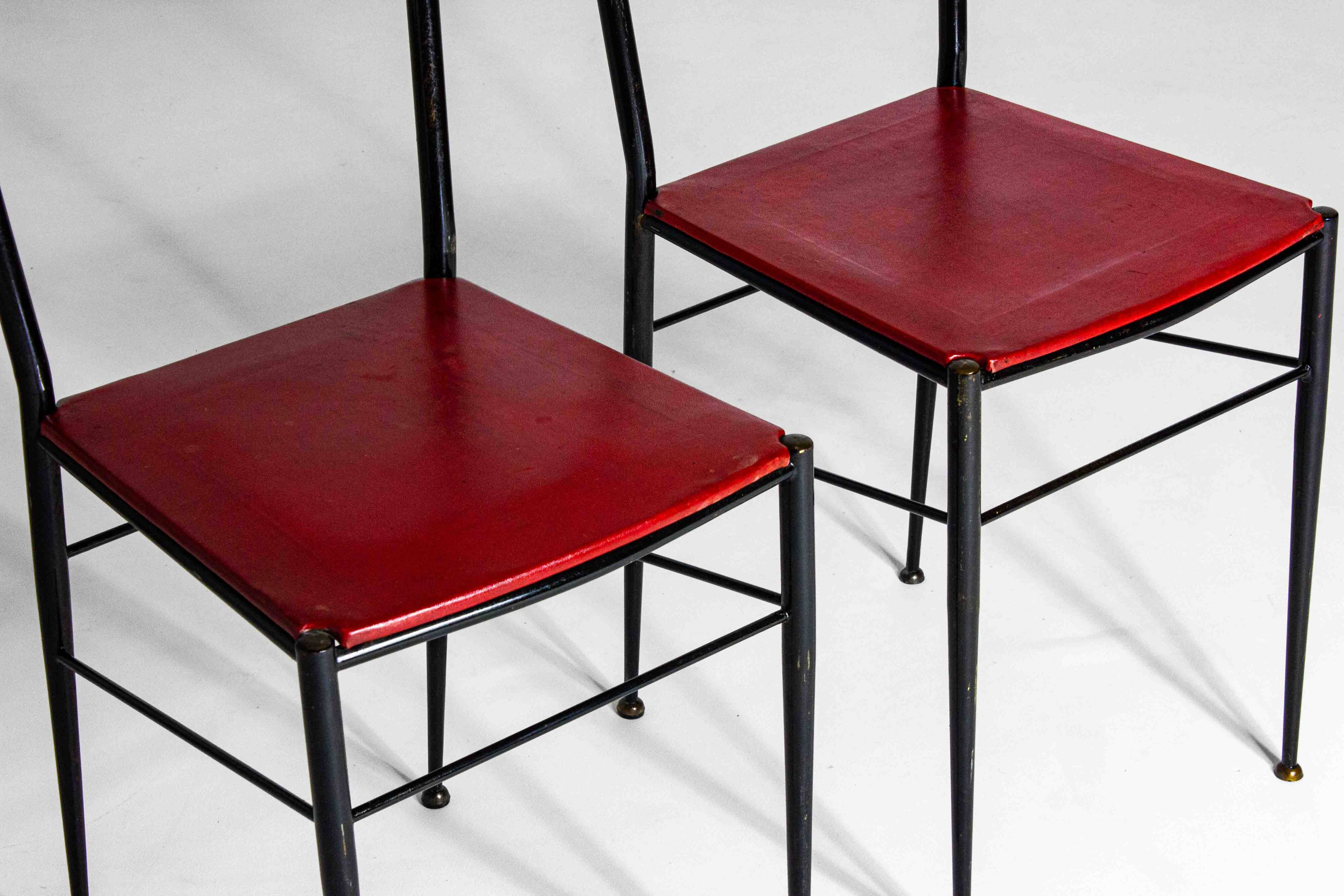 Fine set of metal dining chairs with red leather seating, Italy 1970s