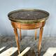 Hot water bottle table with a marble top and a brass gallery.
