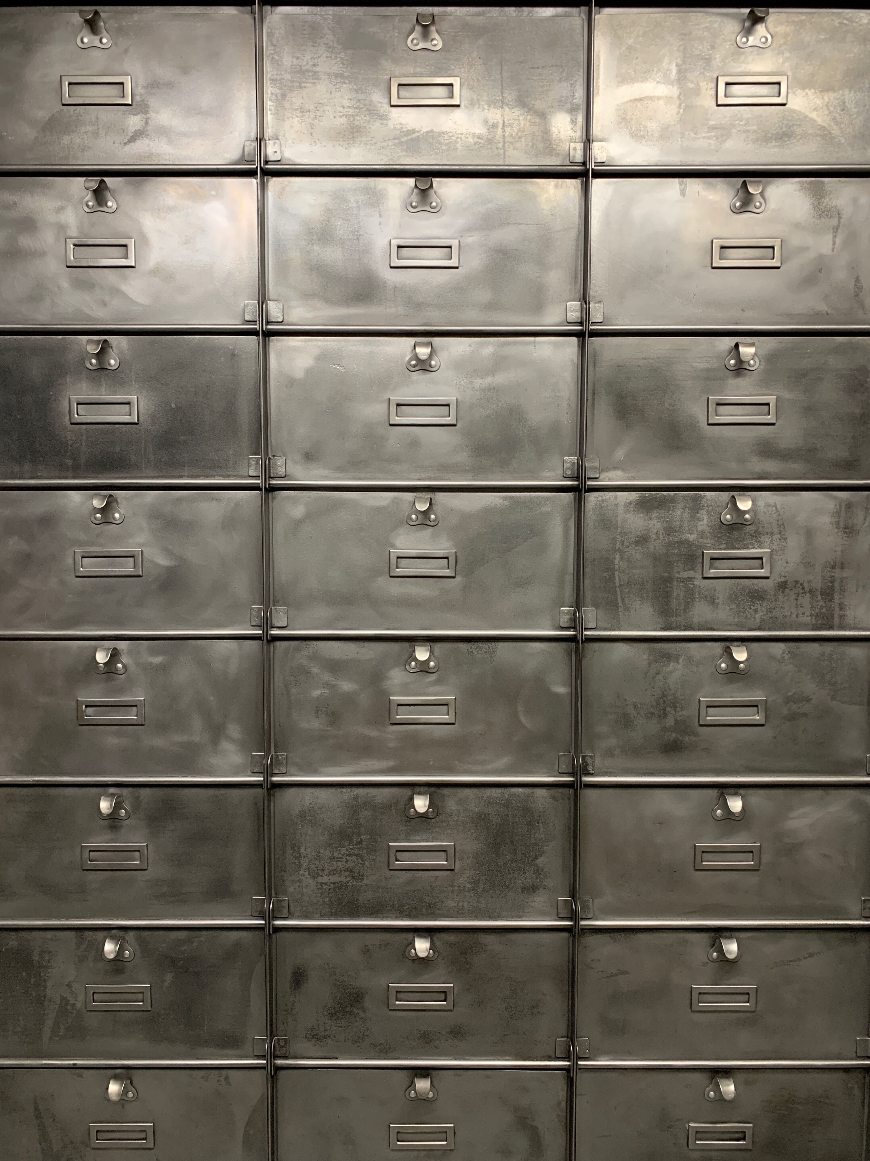 Industrial cladding furniture in brushed and patinated steel