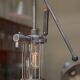 Old gas pump floor lamp in cast iron metal and glass 1930