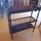 Magazine/book rack in oak with a caned top - early 20th century