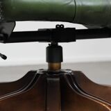 Large green cowhide Chesterfield office chair in English style on wheels