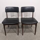Two mid-century faux leather chairs