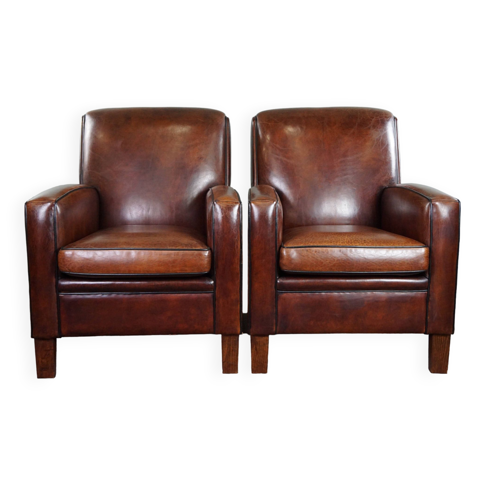 A very beautiful set of 2 Art Deco design armchairs in sheep leather