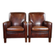 A very beautiful set of 2 Art Deco design armchairs in sheep leather