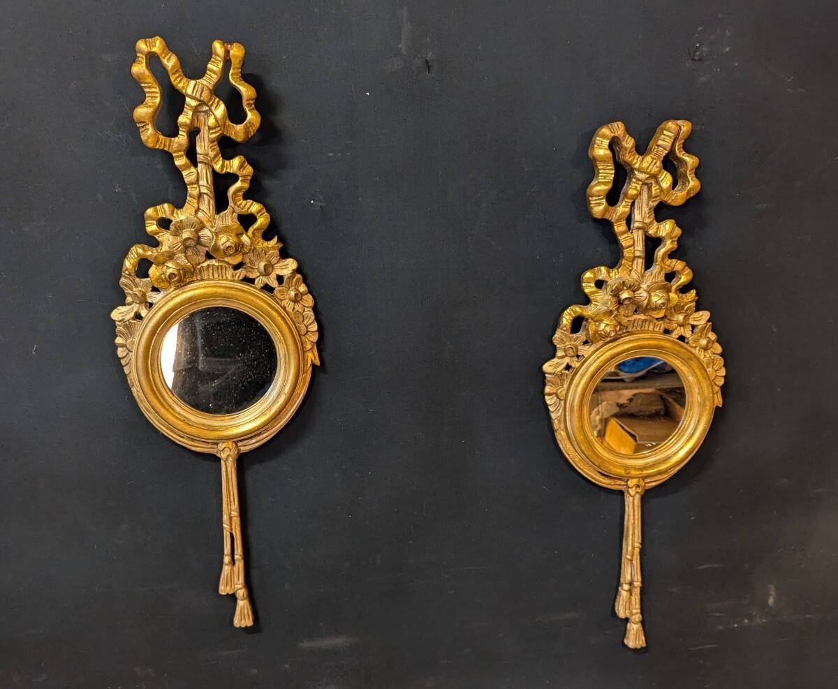 Pair of round Louis XVI style giltwood mirrors