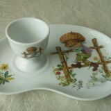Porcelain egg cup on frame Limoges Poulbot de Paris