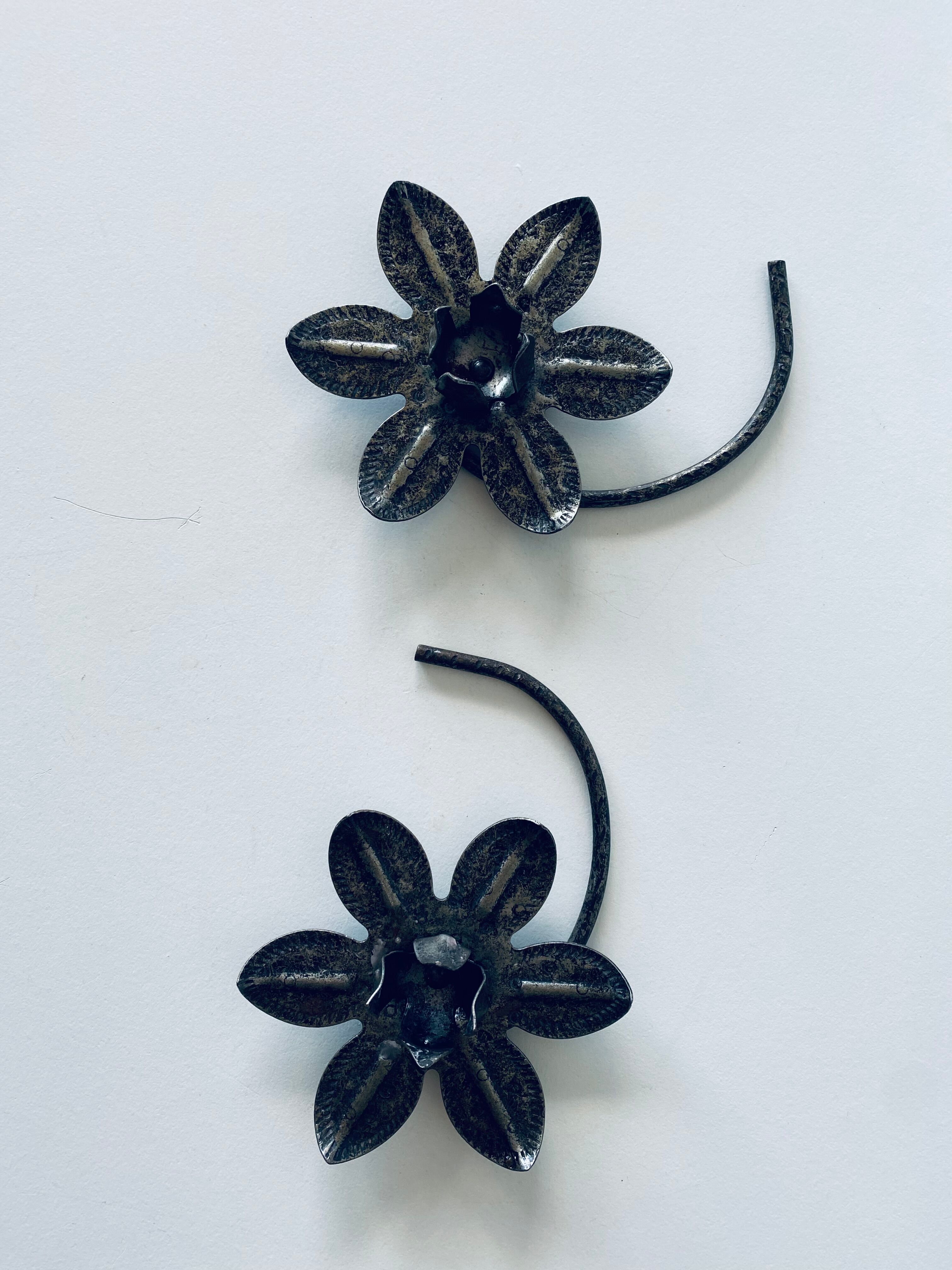 Pair of iron water lily candle holders