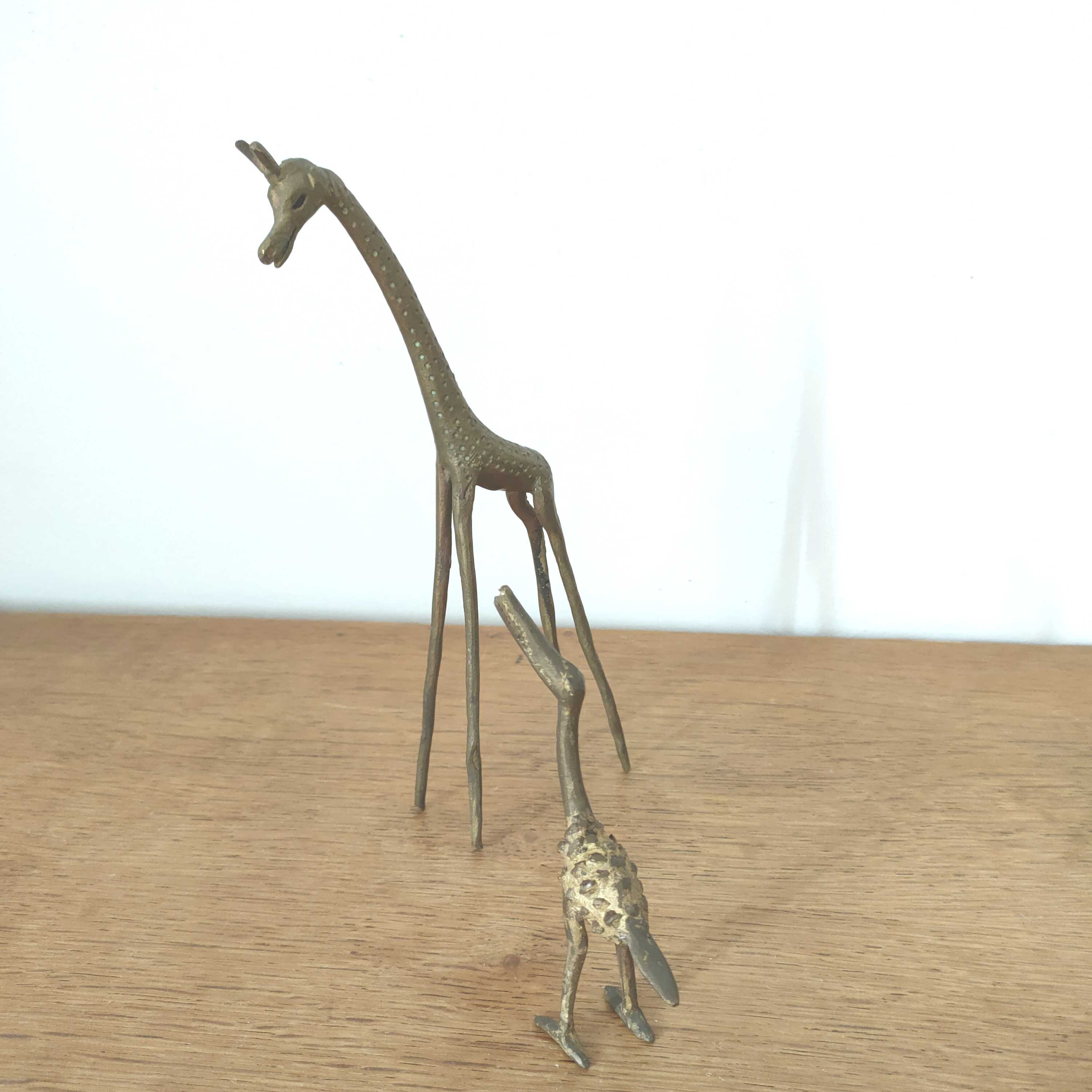 Giraffe and brass bird