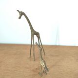 Giraffe and brass bird