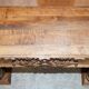 Antique fireplace from around 1880 in solid hand-carved elm with openwork columns.