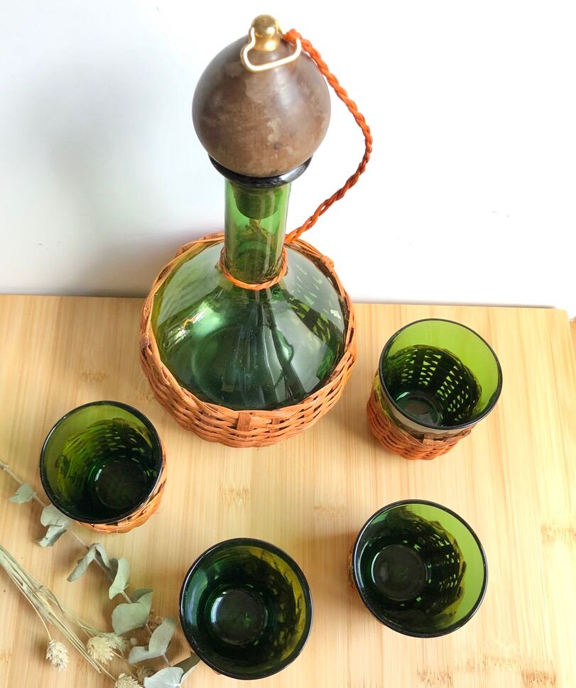 Service carafe and vintage glasses, with wicker