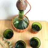 Service carafe and vintage glasses, with wicker