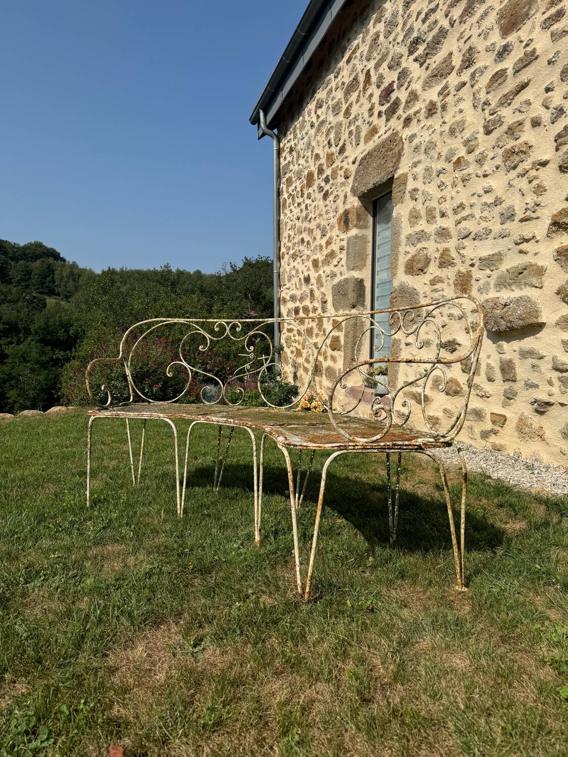Wrought iron half-moon bench