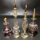 Set of 8 blown glass perfume bottles gilded with 12 carat gold