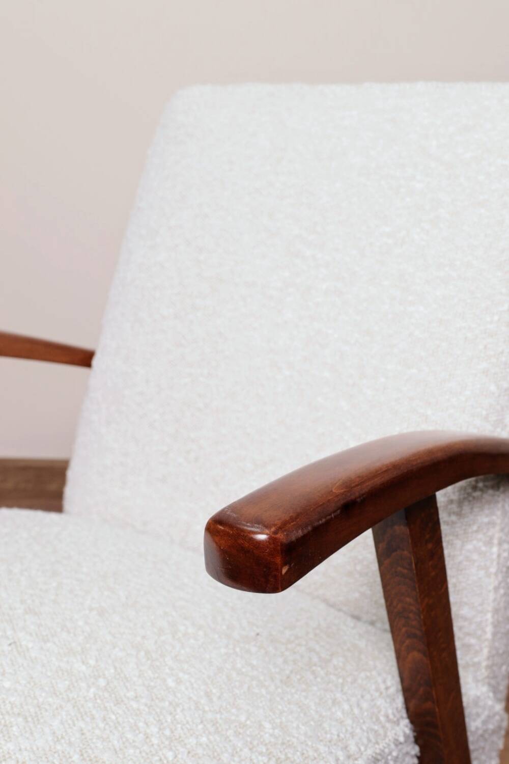 Vintage armchair in pearl bouclé, mid-century modern design from the 1960s.