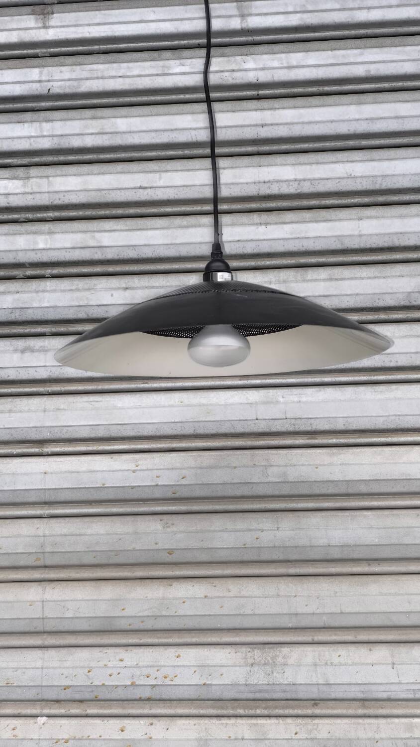 Perforated lacquered sheet metal suspension from the 90s