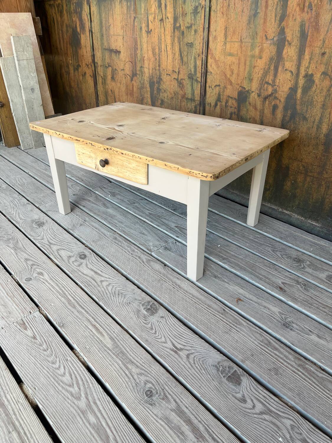 Raw wood and taupe coffee table