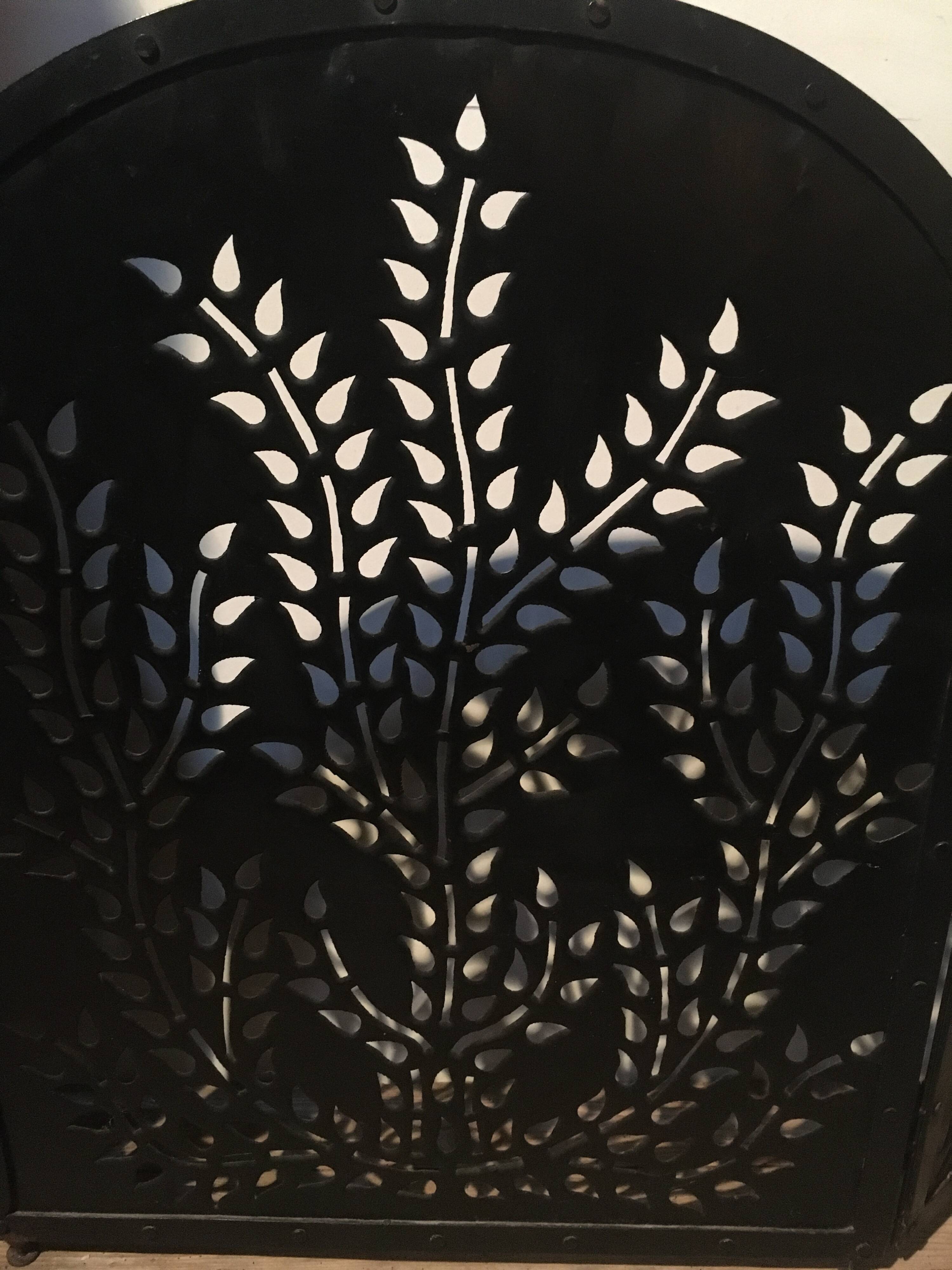 Wrought and cut metal fire screen