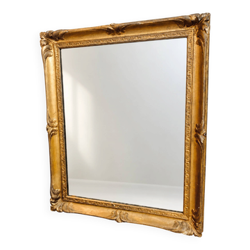 Miroir ancien à cadre doré et décor de feuillages