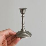 Pair of small metal candle holders, classic design.