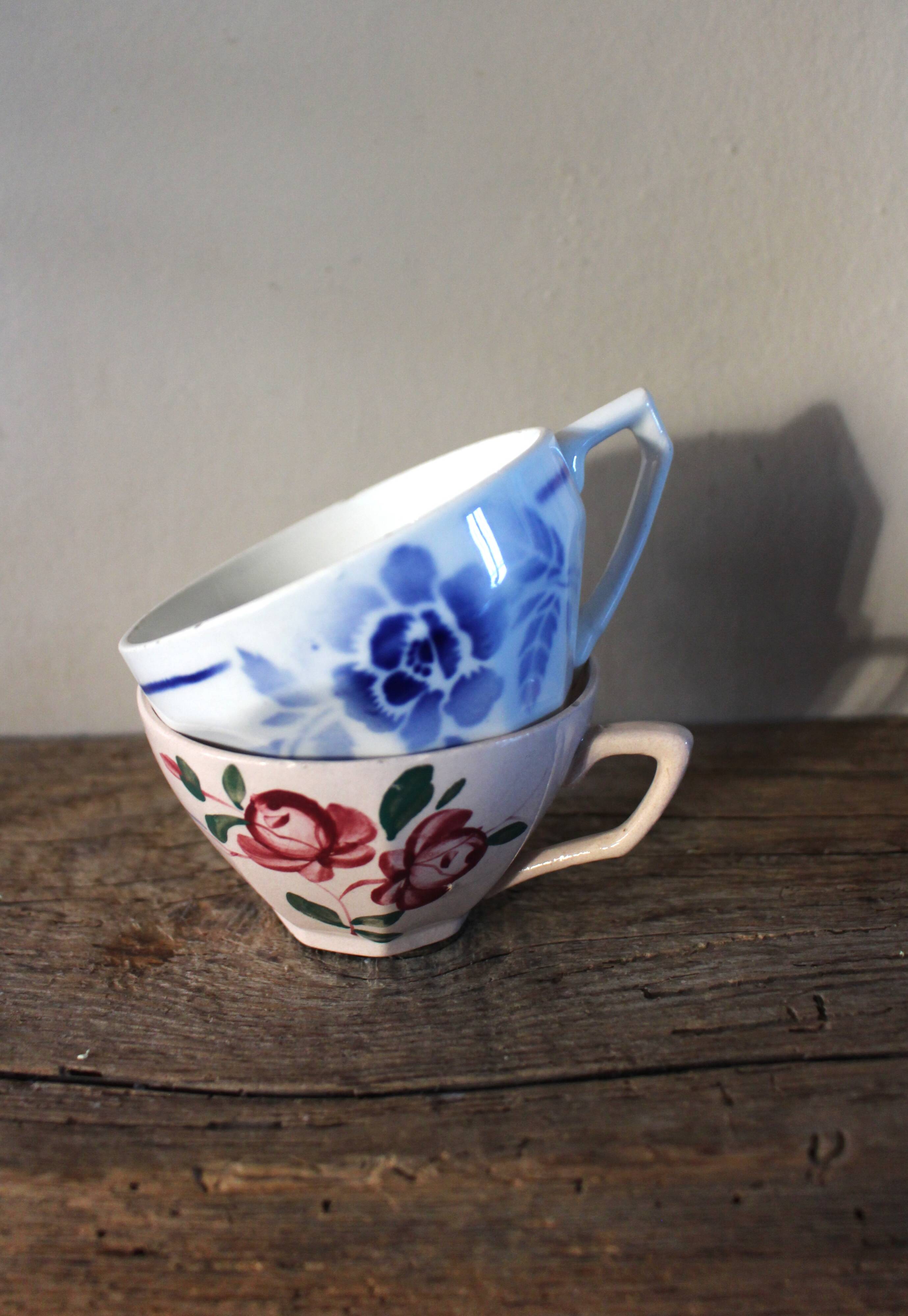 A set of 2 Digoin Sarreguemines cups with pink and blue flowers.