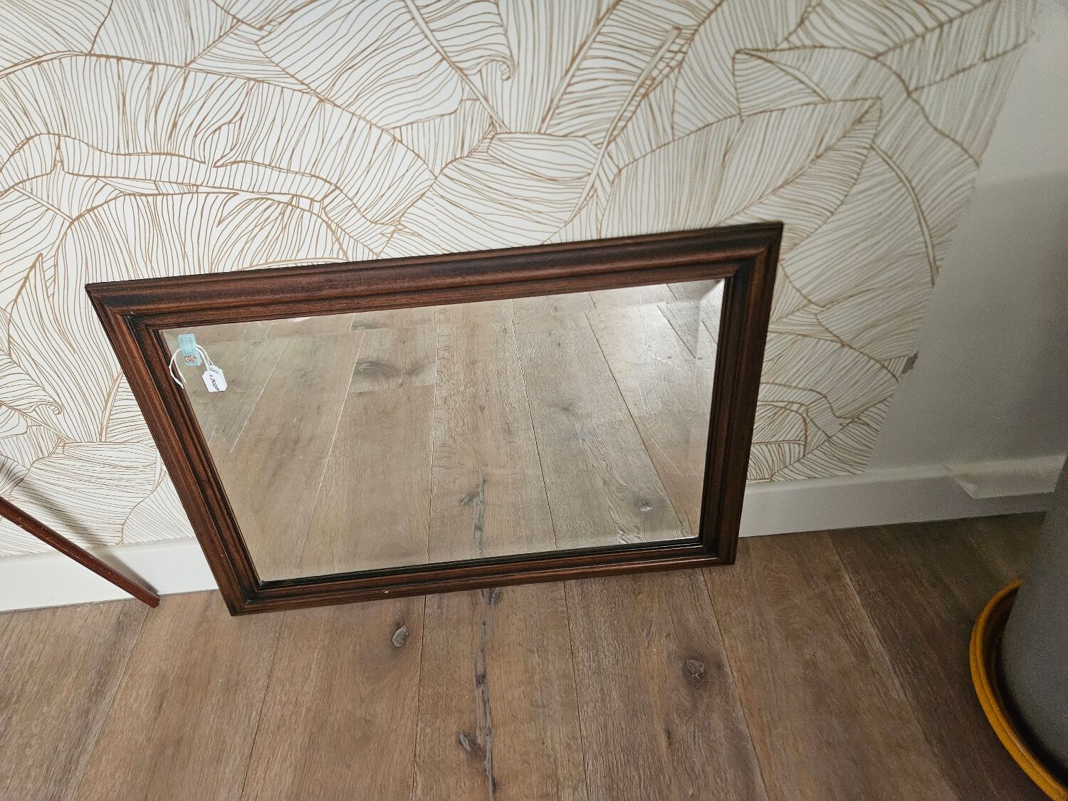 Beveled glass mirror in its wooden frame