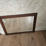 Beveled glass mirror in its wooden frame