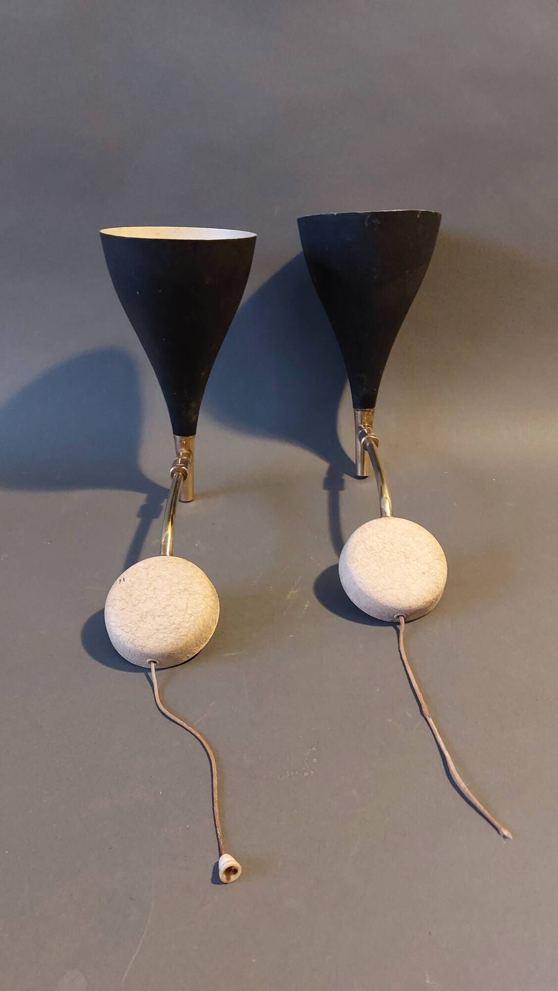 Pair of bedroom sconces in gilded brass and black aluminum 1960.