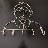 Pair of iron coat holders girl and boy