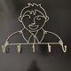 Pair of iron coat holders girl and boy