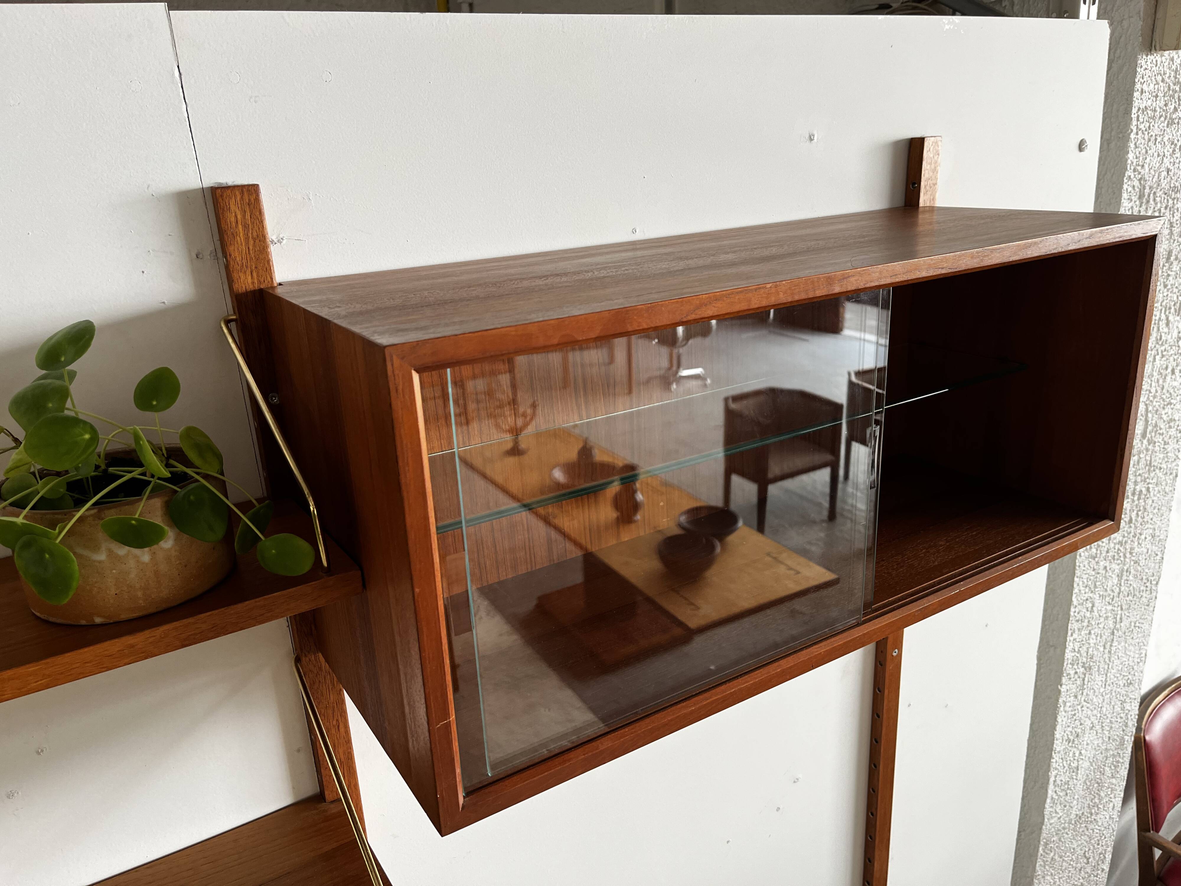 A wall unit with 4 compartments by Poul Cadovius, Denmark, 1960s.